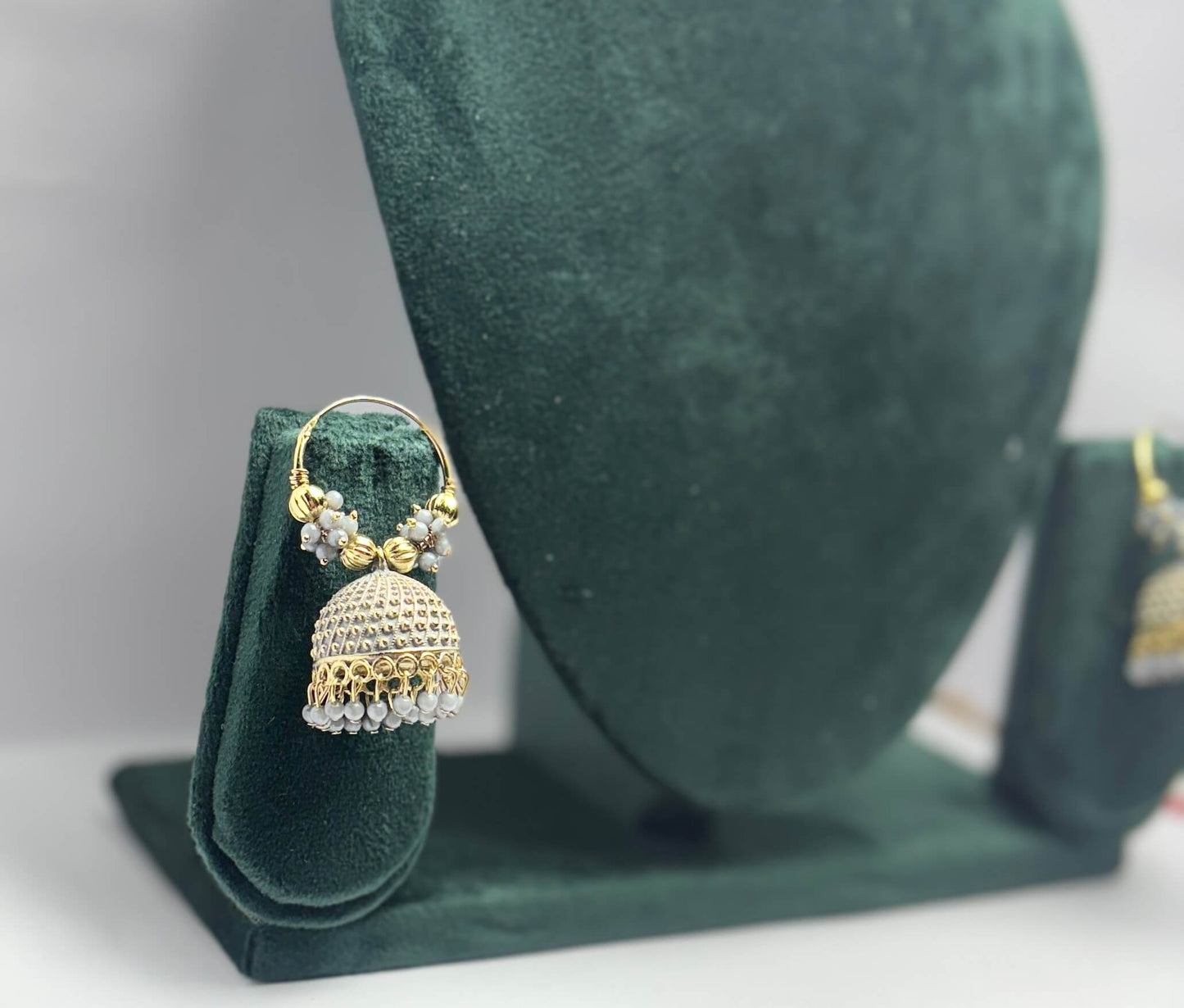 Pair of golden hoop earrings with grey beads