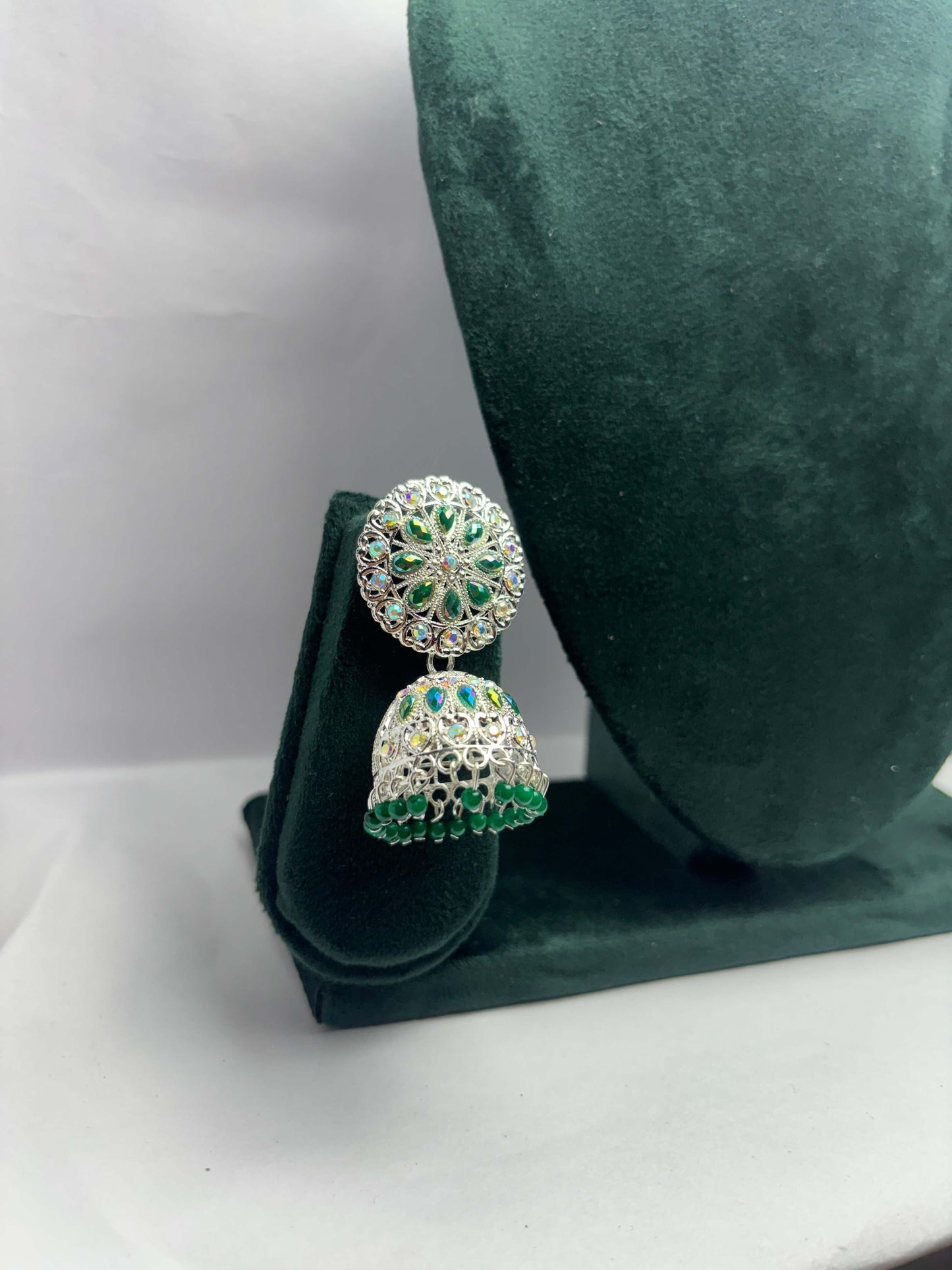 pair of silver oxidized jhumka with green beads