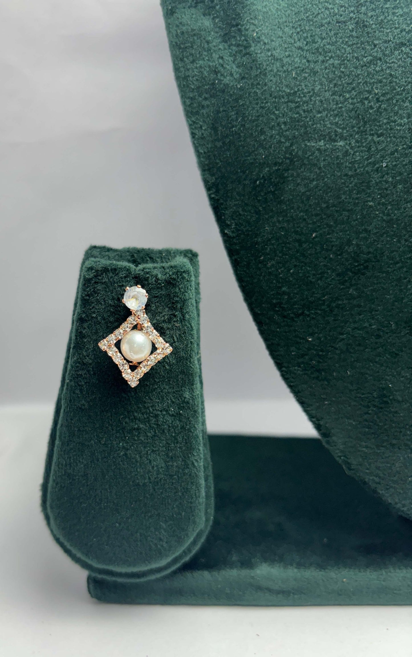 Pair of diamond shaped white pearl earrings