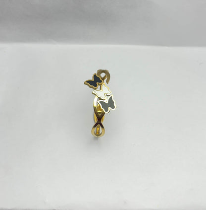Gold and black pendant on a white background