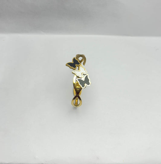 Gold and black pendant on a white background